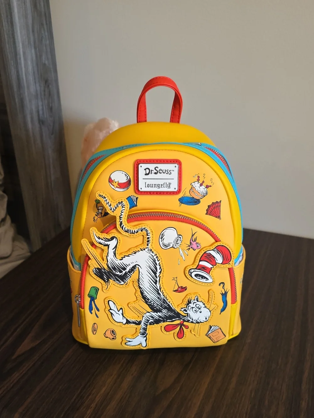 Loungefly Dr. Seuss Yellow Cat in the Hat Mini Backpack with Red & Blue Accents